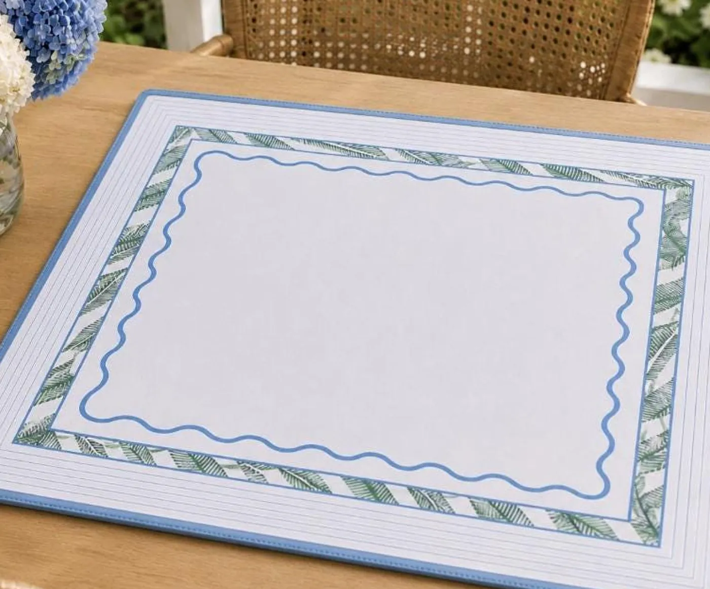 The Preppy and Tropical mat on its own on a wood table