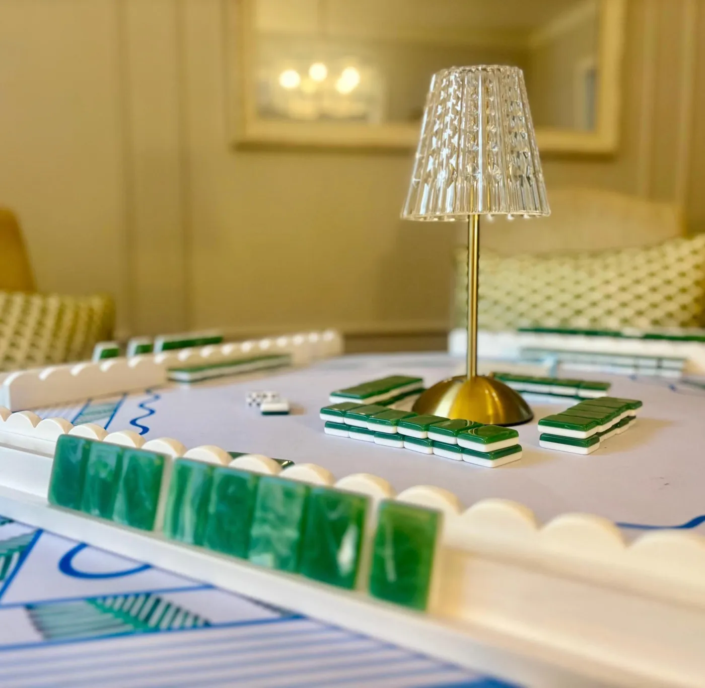 A Mary Grace table set for an evening game with a crystal lamp