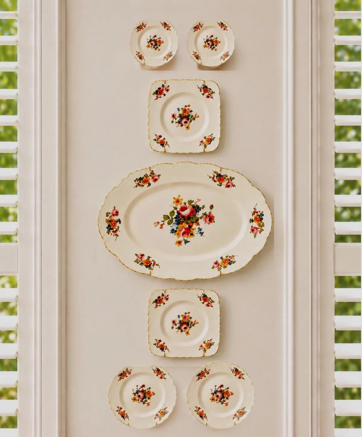 A vintage floral porcelain plate wall